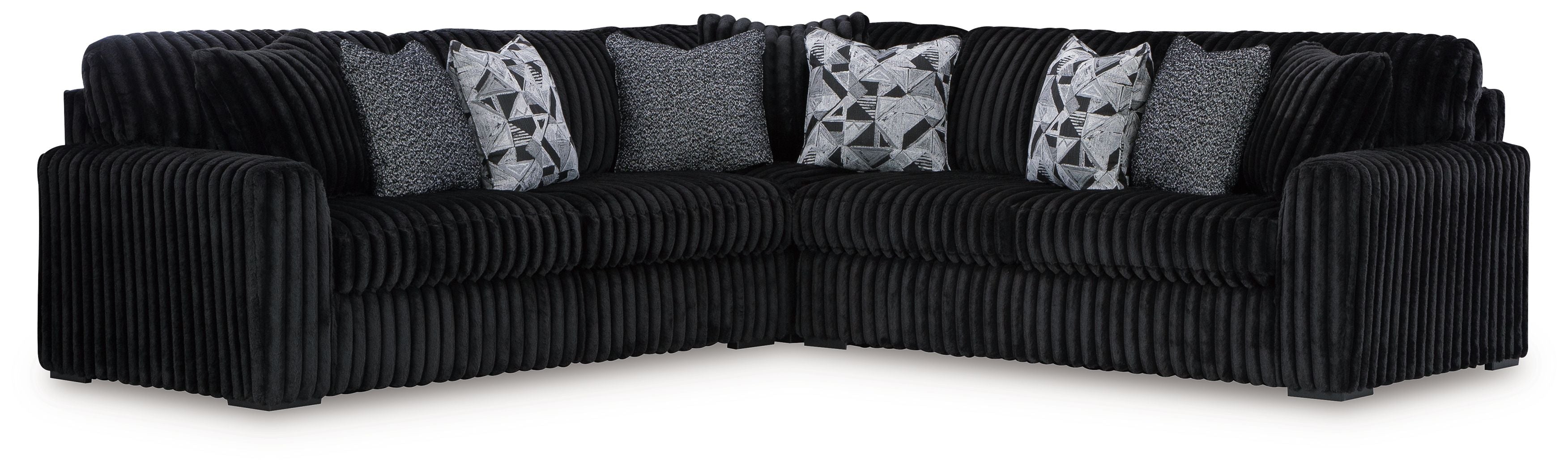 Black U-shaped sectional sofa with ribbed texture and four patterned throw pillows