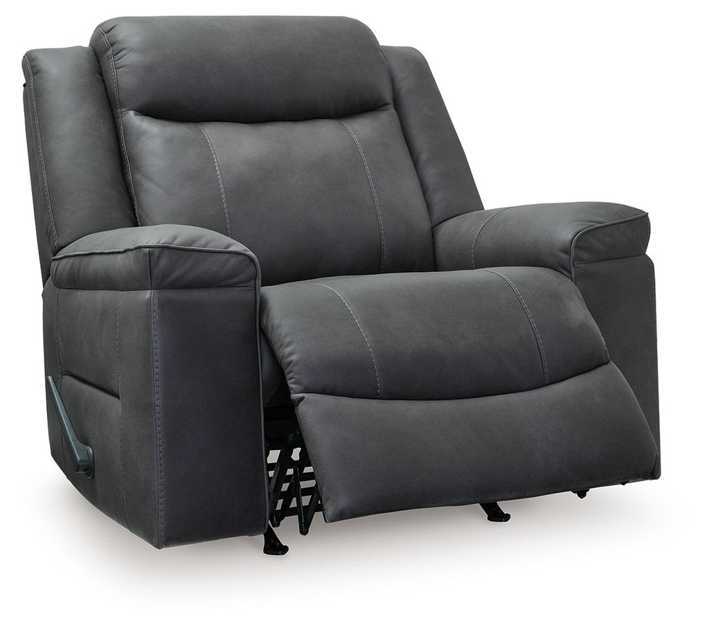 Dark gray rocker recliner chair with extended footrest and padded arms; visible control.
