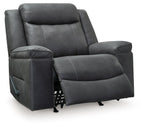 Dark gray rocker recliner chair with extended footrest and padded arms; visible control.