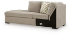 Stone gray left-arm corner chaise with angled armrest, patterned pillow, black base