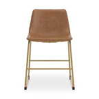 Dining side chair with tan upholstered seat and back, gold metal frame, black feet