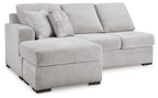 Light gray fabric sofa chaise with chaise ottoman and two back cushions