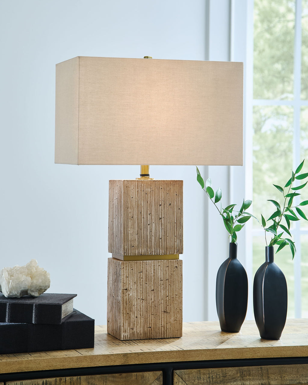 Beige rectangular fabric table lamp with stacked wood block base and brass neck