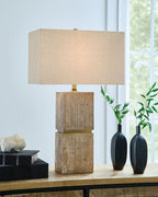 Beige rectangular fabric table lamp with stacked wood block base and brass neck