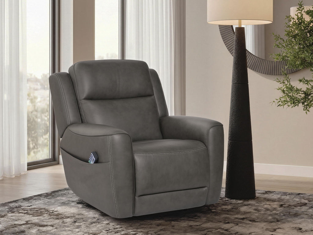 Dark gray power lift recliner with padded arms and sleek seat, shown in a living room