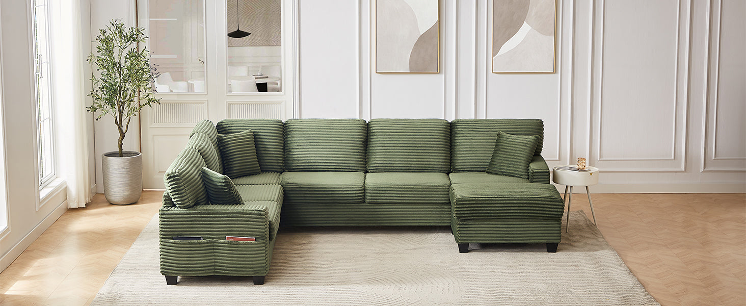 Green corduroy sectional sofa with chaise-style chaise section and movable ottoman