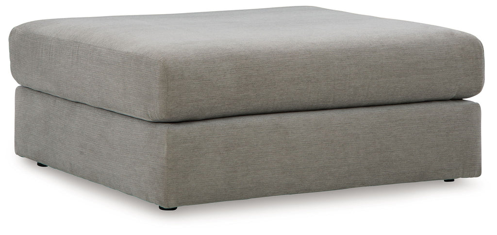Gray upholstered ottoman with square top and tapered legs
