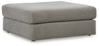 Gray upholstered ottoman with square top and tapered legs