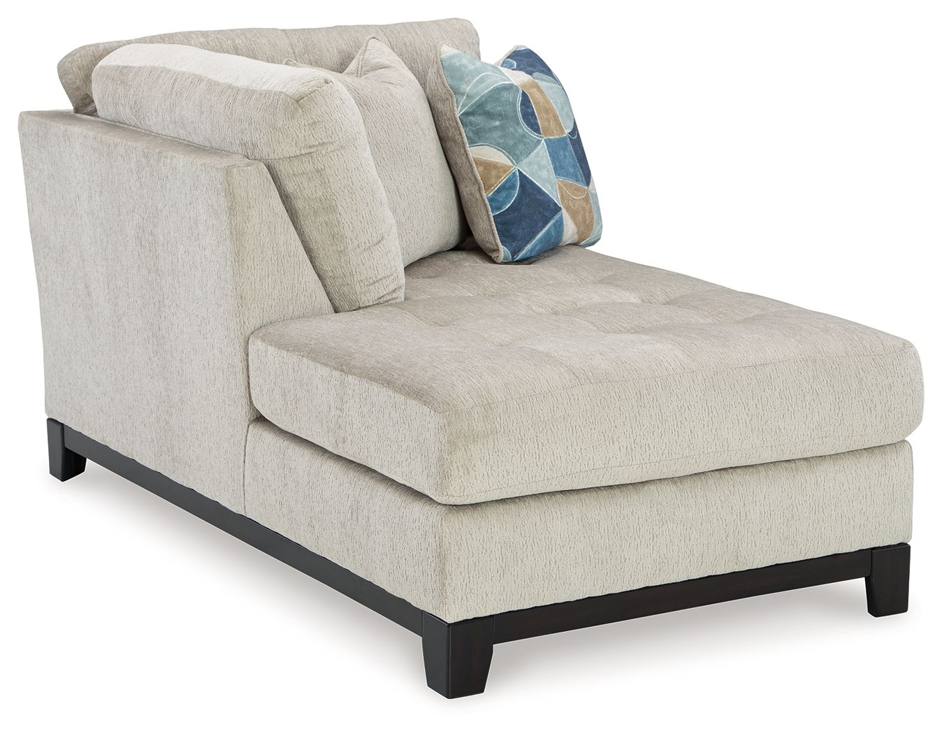 Stone corner chaise with left-facing seat, square armrest, geometric pillow, dark wooden legs