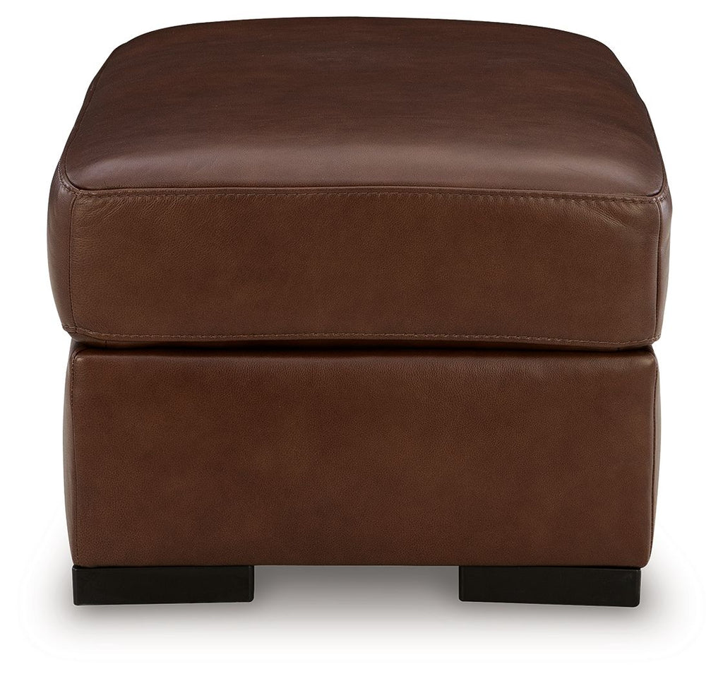 Brown leather ottoman with thick cushioned top and dark square legs