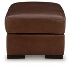 Brown leather ottoman with thick cushioned top and dark square legs