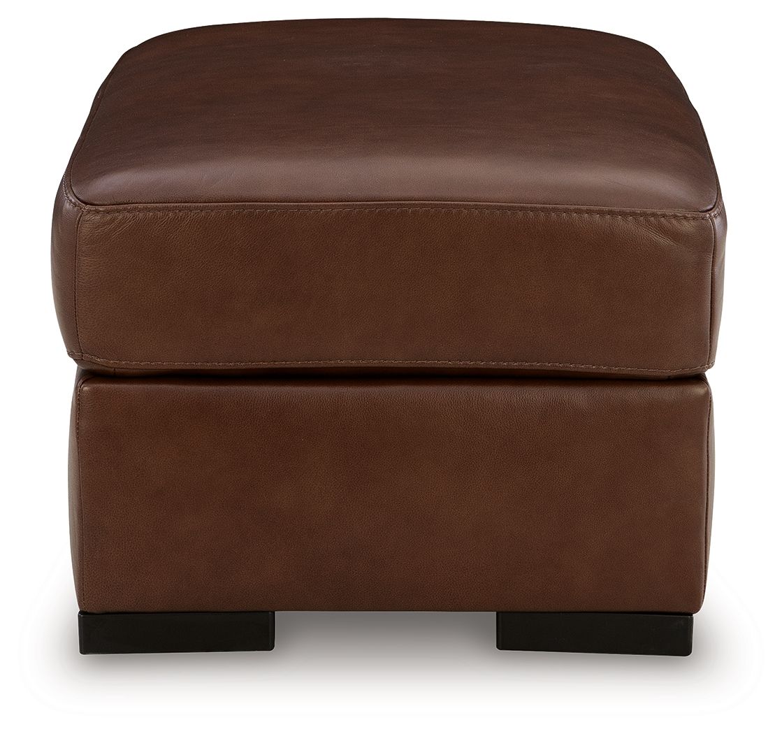 Brown leather ottoman with thick cushioned top and dark square legs