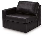 Black upholstered corner chair with square seat and back cushion