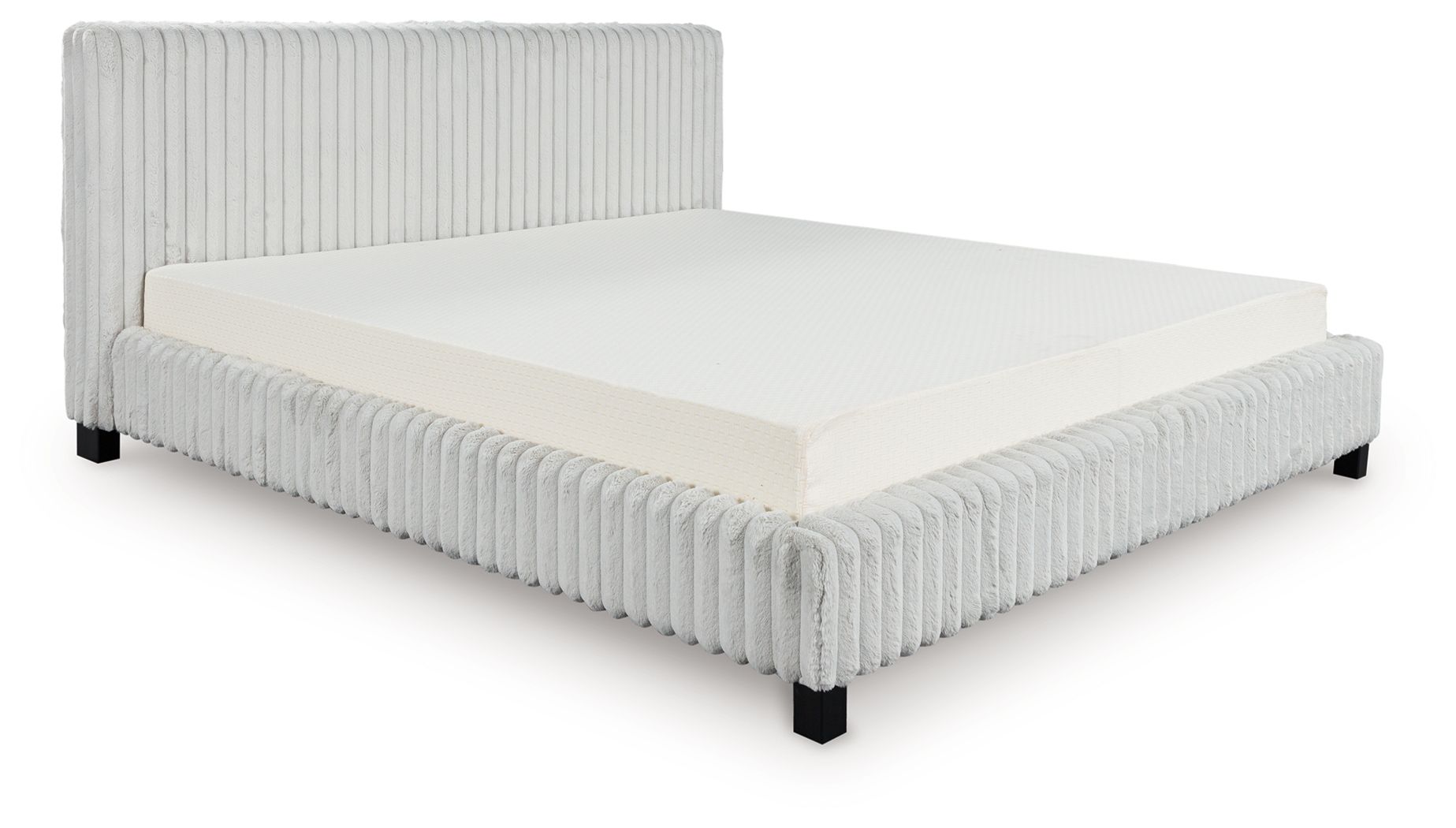 Upholstered bed with light gray ribbed headboard and sides, white mattress