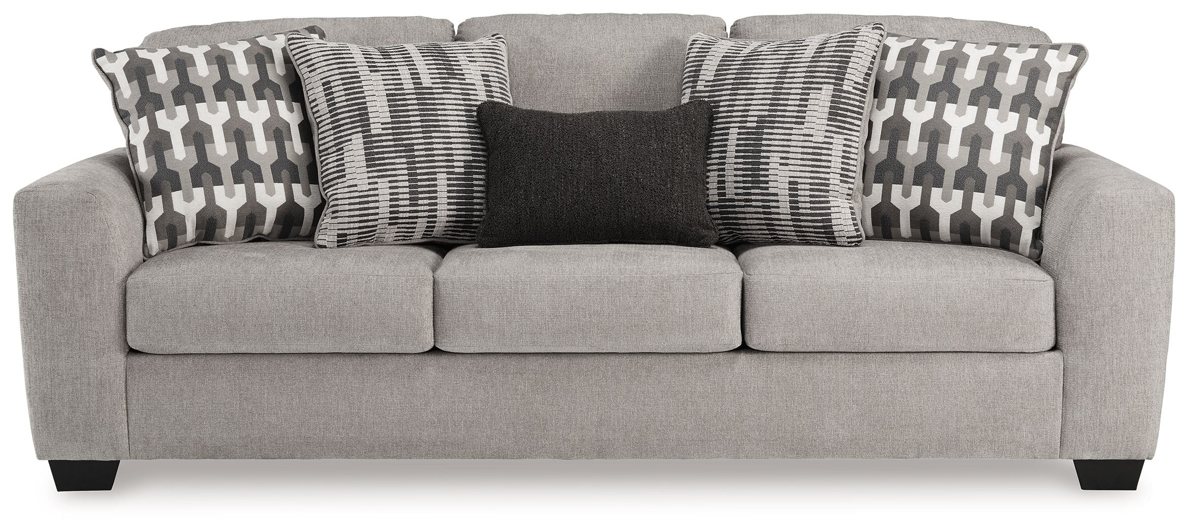Gray flannel sofa with three seat cushions and geometric throw pillows