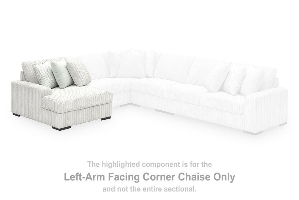 White left-arm corner chaise sofa with ribbed upholstery and two accent pillows