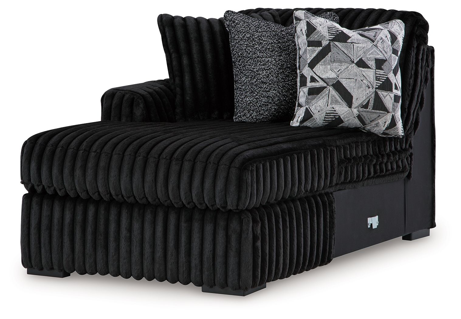 Onyx corner chaise with ribbed plush upholstery, dark frame, and patterned back pillows