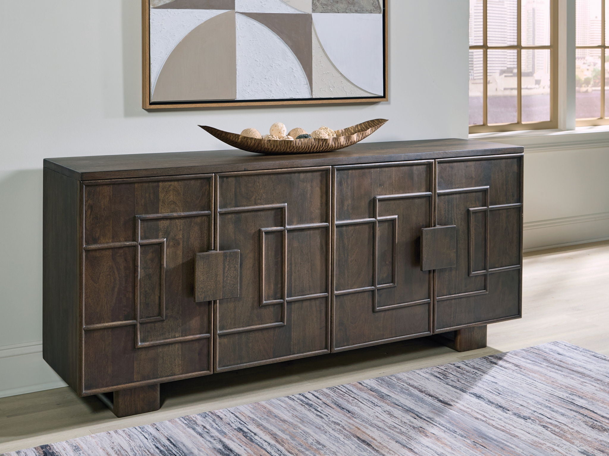 Accent cabinet in dark brown with multiple paneled doors and low wooden feet.