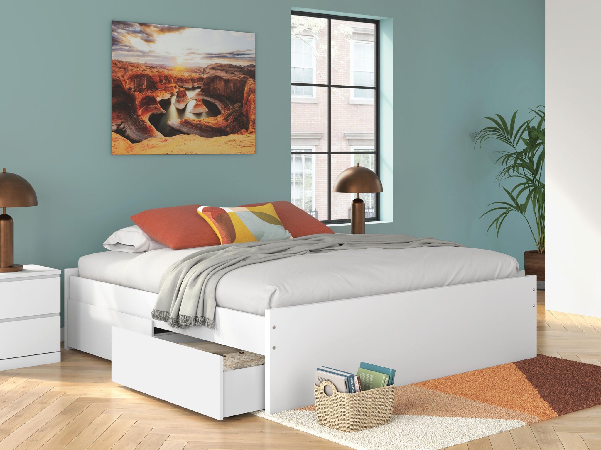 White platform bed with storage drawers and light gray bedding set