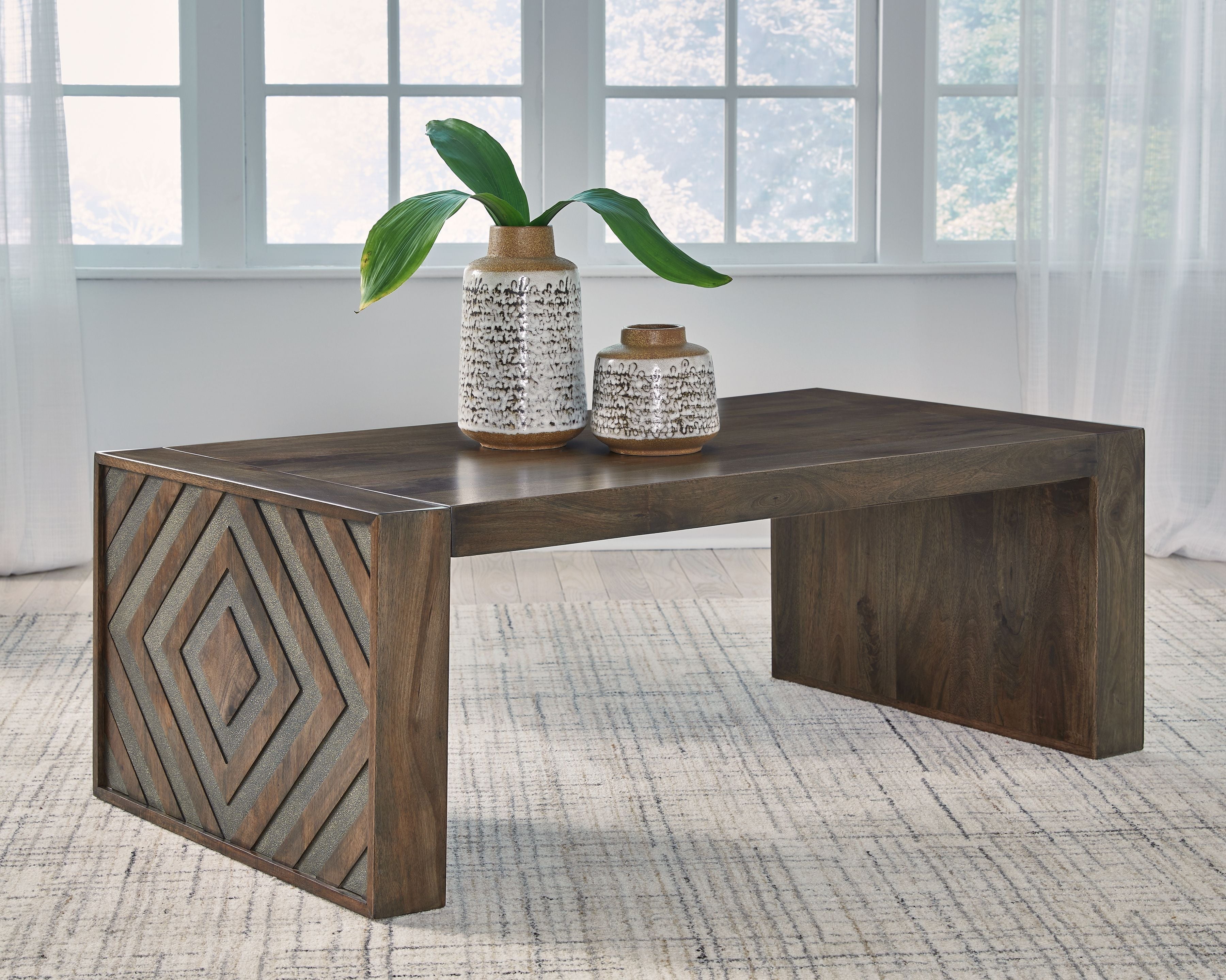 Dreggan rectangular cocktail table in dark brown with geometric side panels
