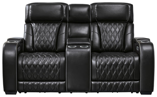 Black power reclining loveseat with center console and diamond-quilted back and seats