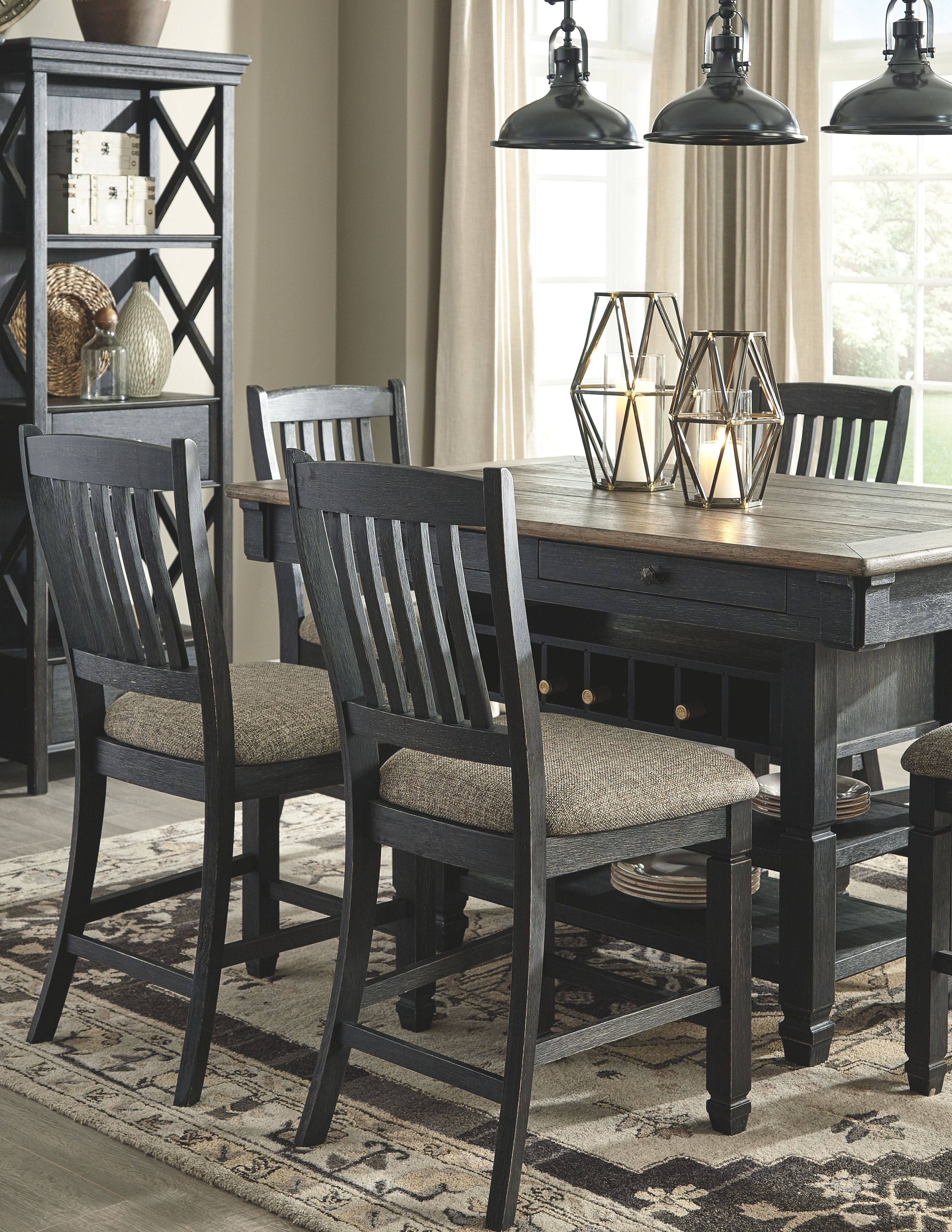 Dark gray counter height dining table with two slat-back bar stools