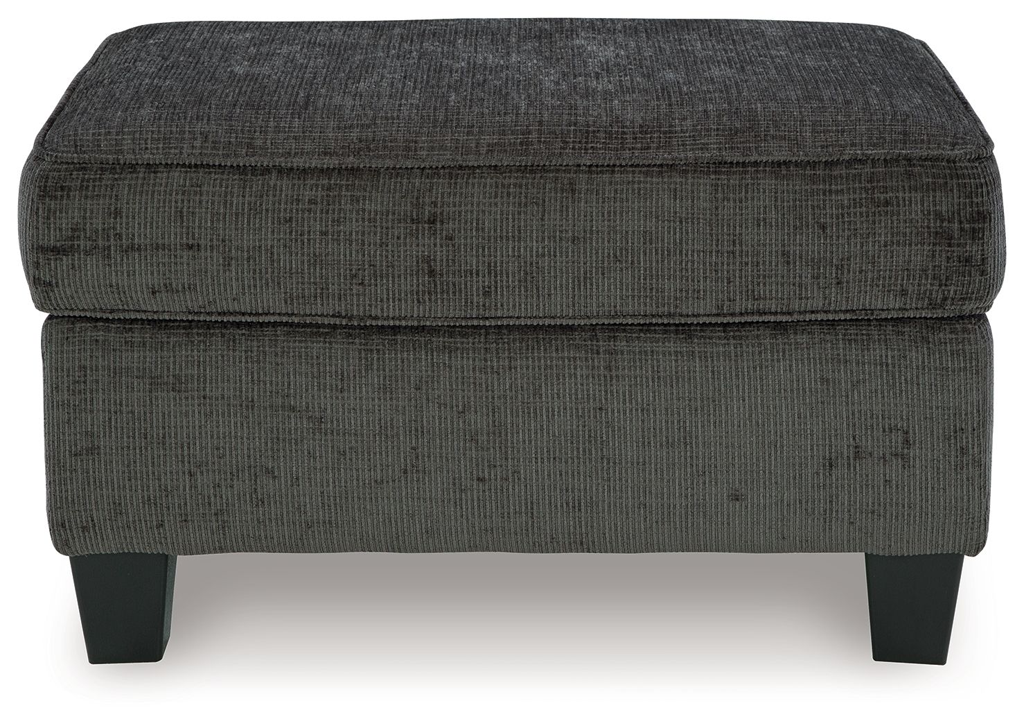 Dark gray ottoman with rounded square top and stitched fabric, short block legs