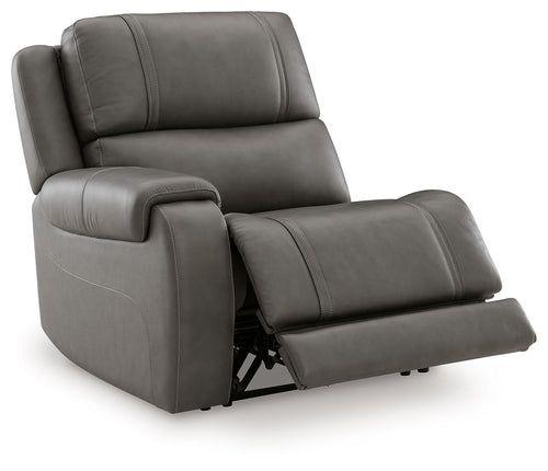 Power recliner in dark gray with footrest extended and padded armrest