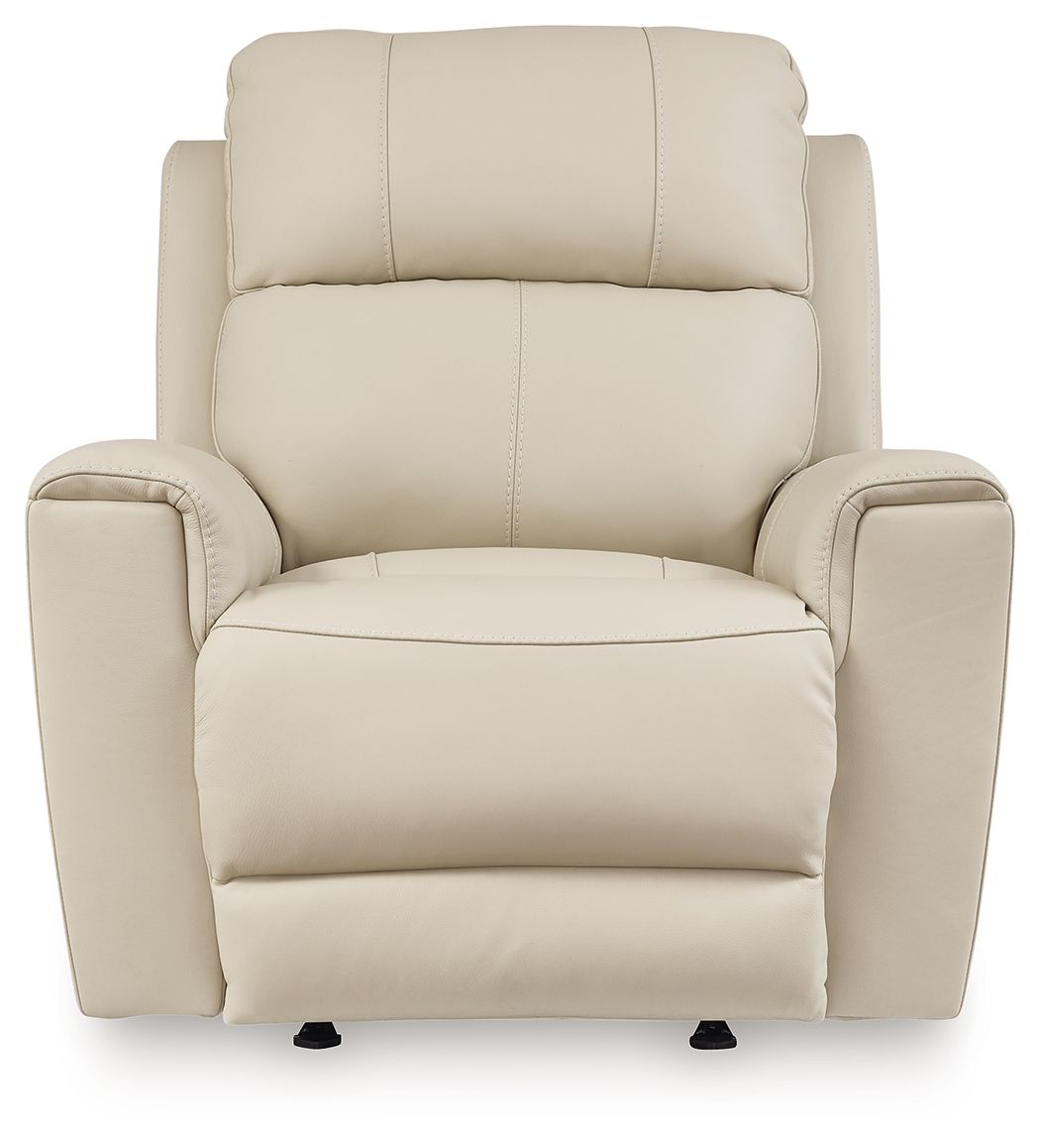 Light beige power rocker recliner with tall back and cushioned seat and arms