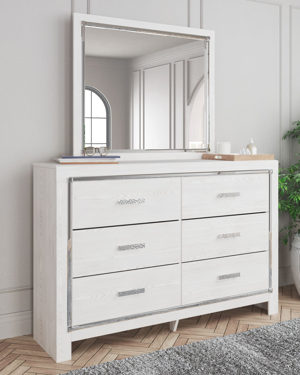 White dresser with mirror, mirror frame above six drawers with horizontal bar pulls