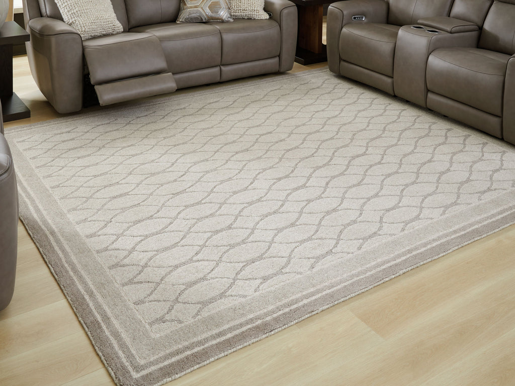 Gray area rug with geometric trellis pattern and border