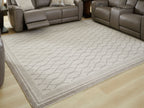 Gray area rug with geometric trellis pattern and border