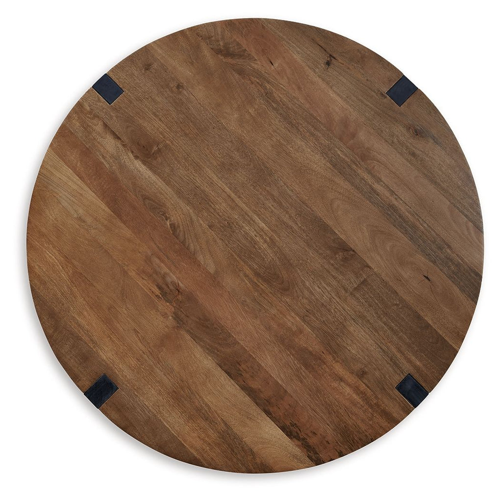 Round brown wood tabletop with dark corner inserts and visible grain
