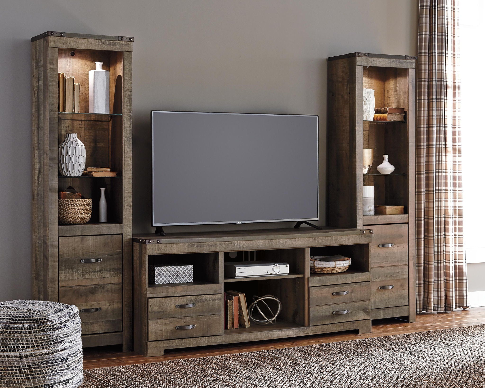 Dark brown TV entertainment center with two glass cabinets, open media shelves, and drawer storage