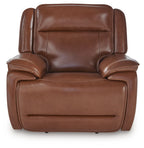 Chocolate brown power recliner front view with tufted back cushions and wide armrests.