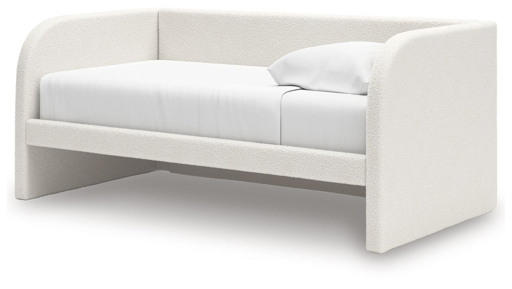Upholstered day bed in beige fabric with white cushions; open space under the frame