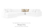 White upholstered sectional wedge with patterned accent pillows on top backrest