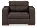 Dark brown upholstered chair, front view, with tufted back and wide padded arms