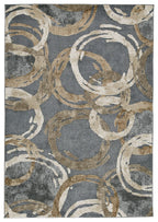 Faelyn rug in dark gray with cream and tan swirling circular pattern