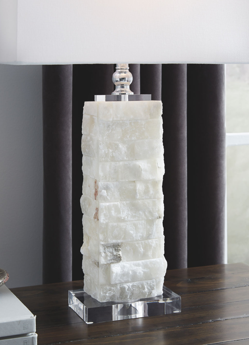White alabaster table lamp with textured cylindrical base and rectangular fabric shade