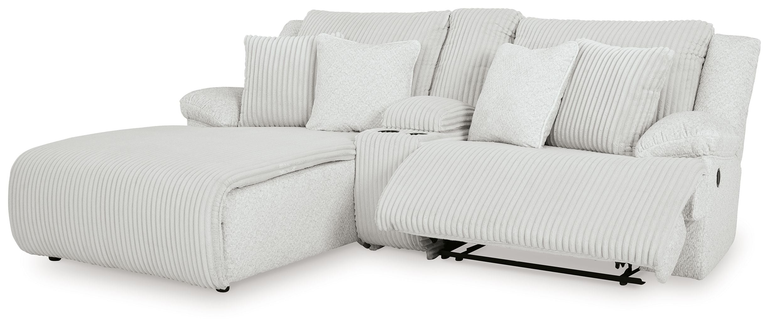 White ribbed reclining sectional sofa with chaise, pillows, and armrests