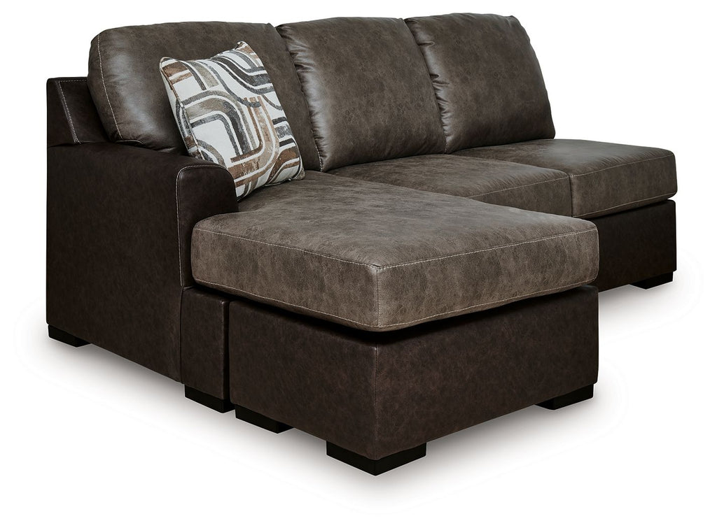 Brown sofa chaise with chaise ottoman, squared arms, and decorative throw pillow