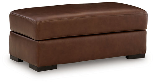 Brown leather upholstered ottoman with rounded top and square block legs