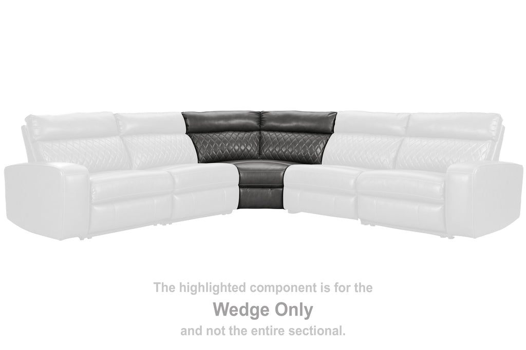 Gray wedge sectional piece with dark back panel and diamond-stitched upholstery
