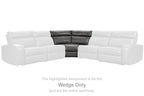 Gray wedge sectional piece with dark back panel and diamond-stitched upholstery