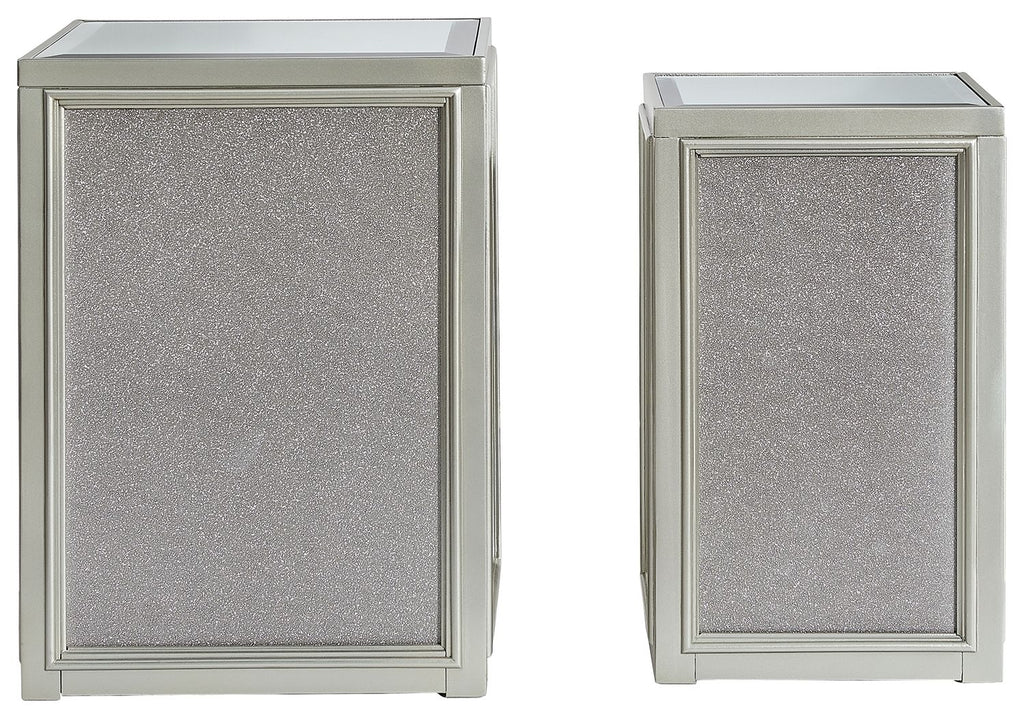 Silver nesting end table with textured panel doors and glass top, side view