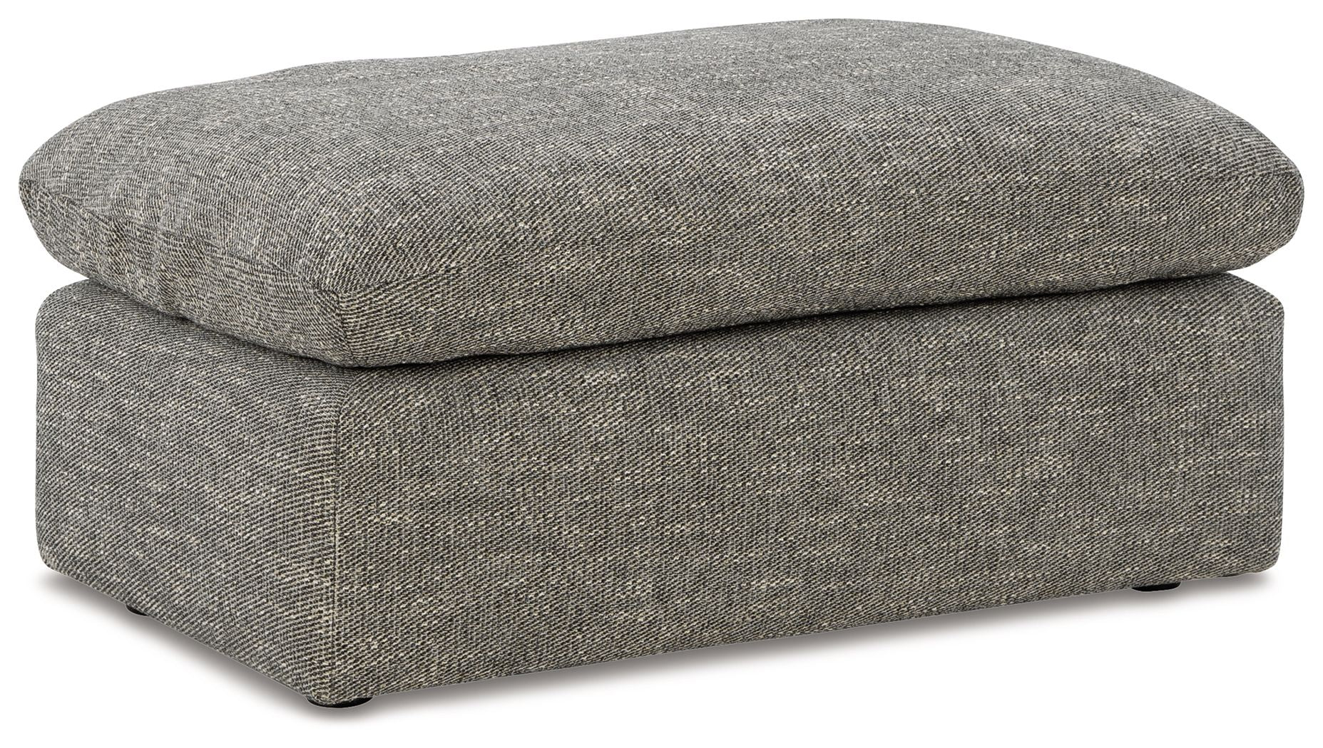 Gray upholstered ottoman with rounded lid, straight sides, and dark feet