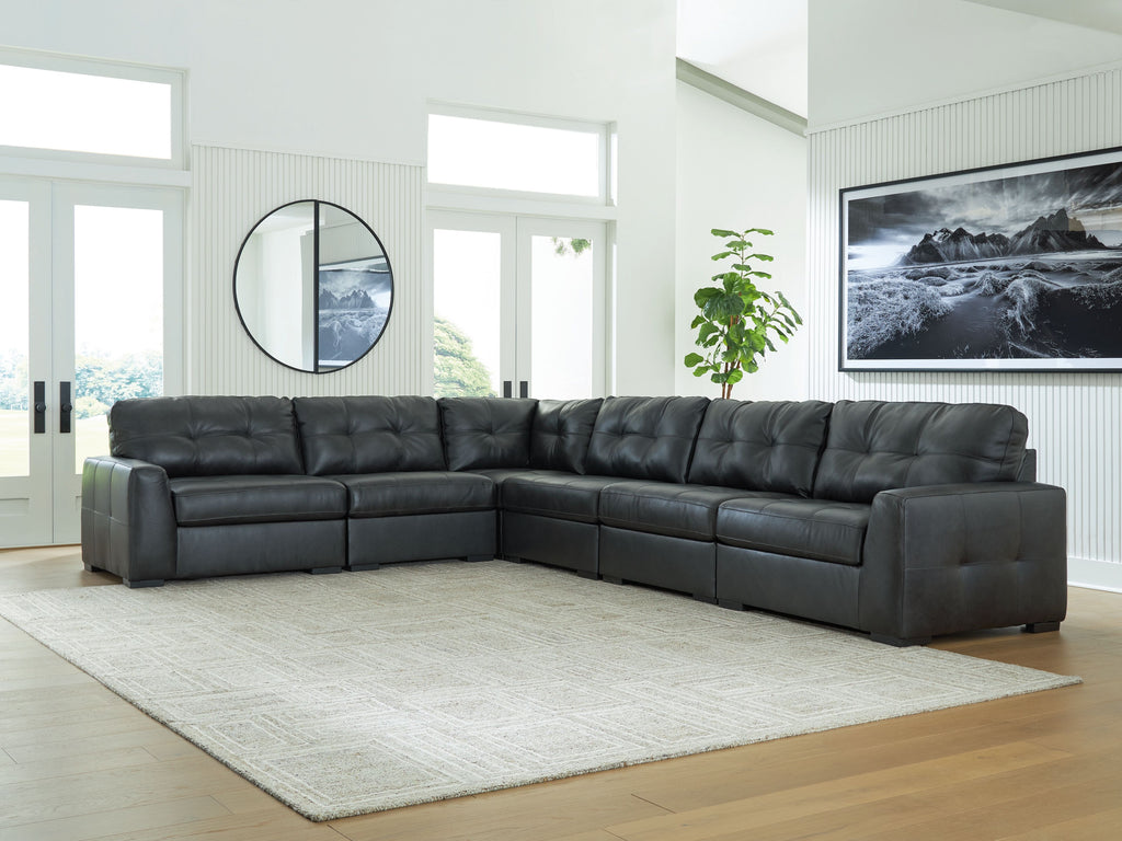 Corner sectional sofa with tufted back and seat cushions in dark upholstery