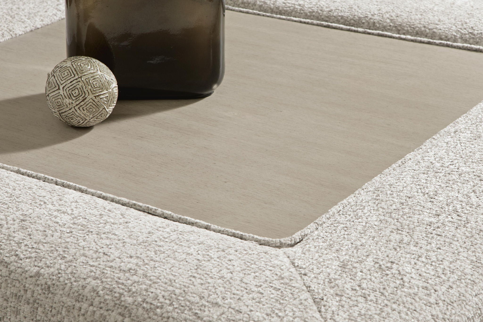 Oversized accent ottoman corner view, snowstone beige textured upholstery, open interior