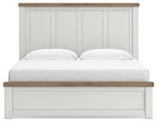 White panel bed with vertical paneled headboard, wood-tone top rails.